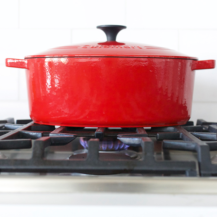 Red Dutch oven on gas stove